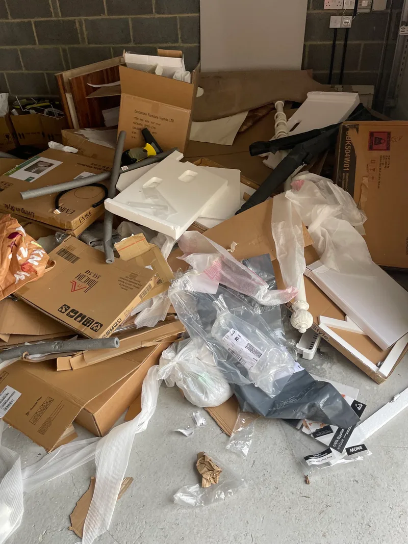 Cardboard packaging and other waste awaiting collection